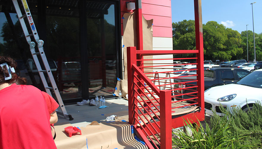 Students repainting Solar House