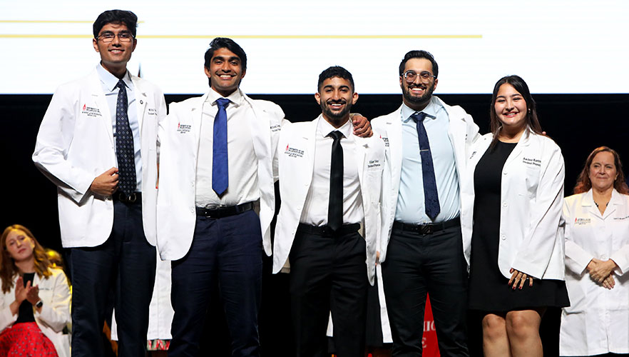 Students in their white coats