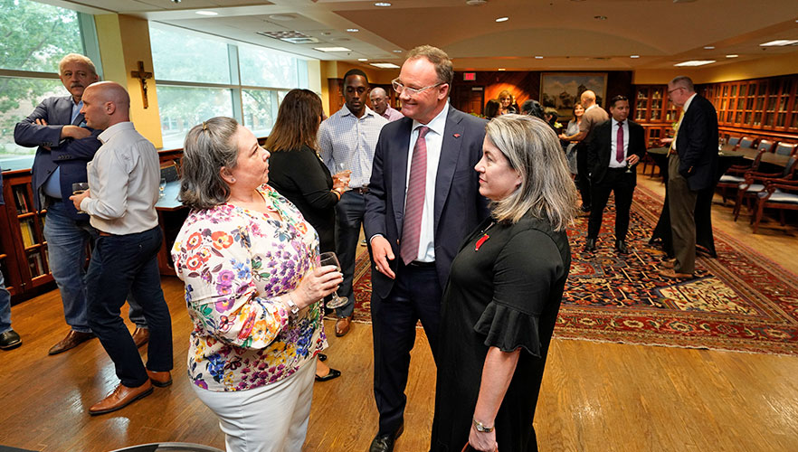 Tracy Avery talking to Dr. Evans and Lisa Evans