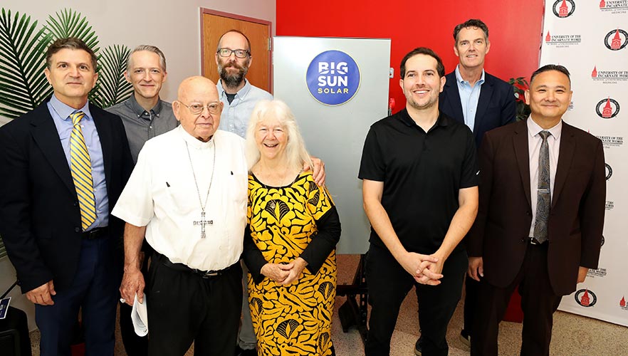 presenters and participants smiling for group photo