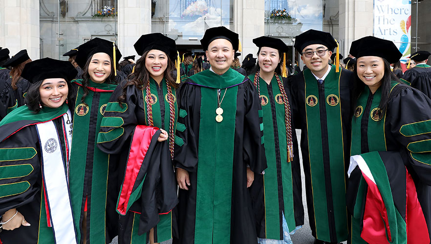 Dr. John T. Pham with UIWSOM graduates