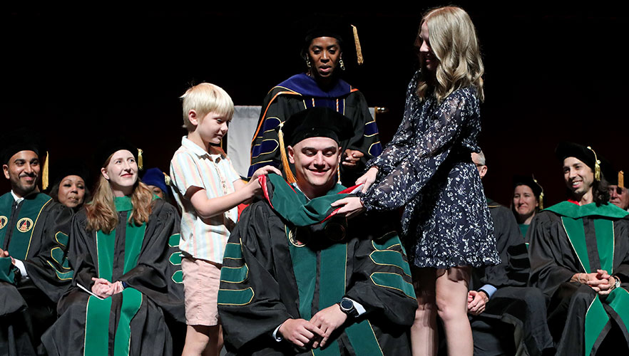 UIWSOM graduate being hooded