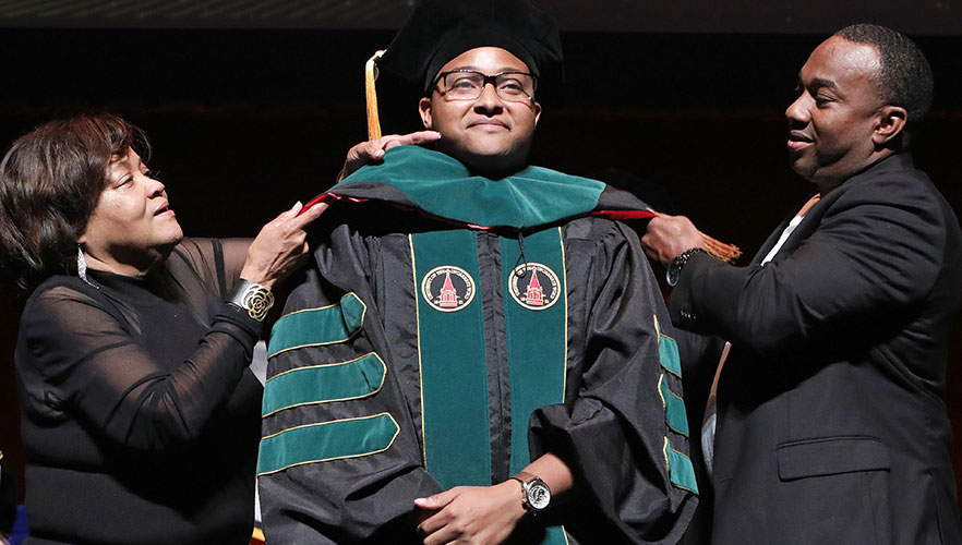 UIWSOM graduate being hooded