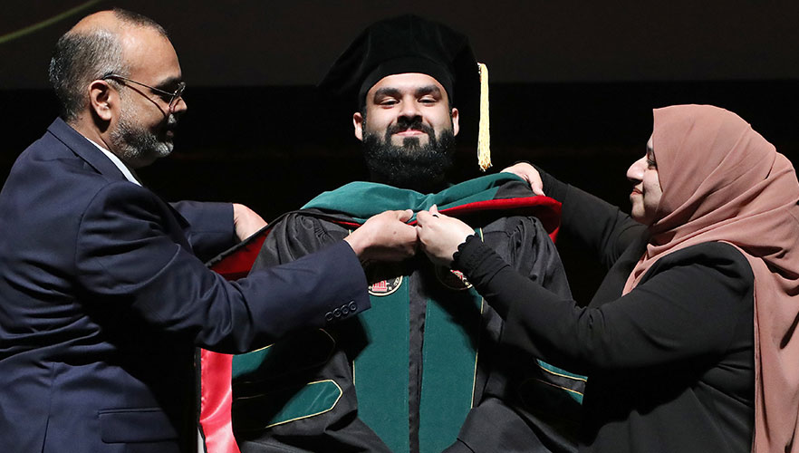 UIWSOM graduate being hooded