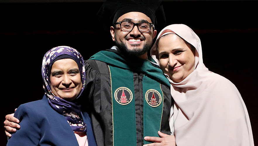 UIWSOM graduate being hooded