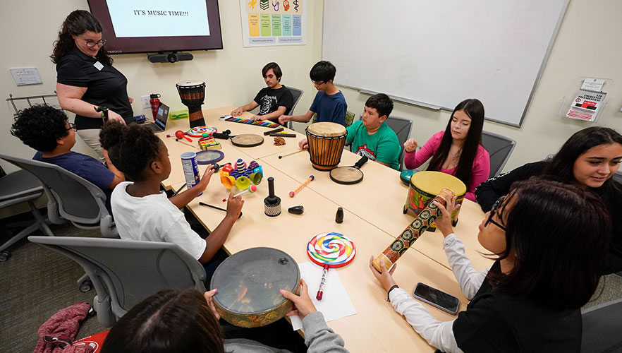 Students learning about music therapy