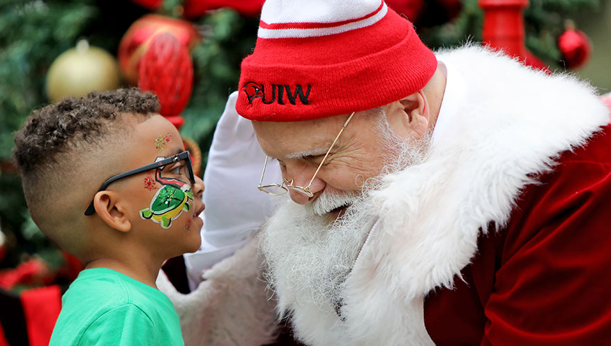 Santa smiling at kid
