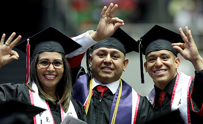 Three graduates at UIW's commencement ceremony