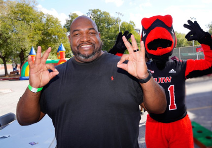 Cardinal with hand signal